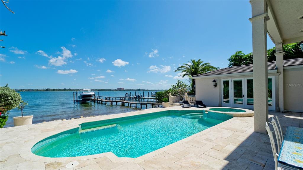 8213 Midnight Pass Road Sarasota, FL 34242 - Photo 50 of 52 a view of a house with a swimming pool