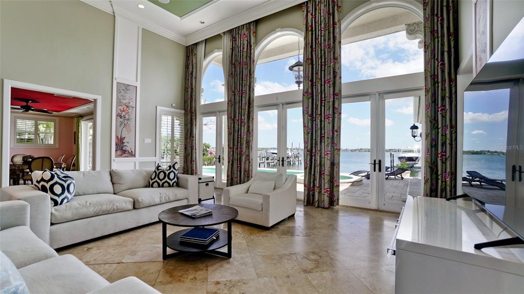 8213 Midnight Pass Road Sarasota, FL 34242 - Photo 8 of 52 a living room with furniture and a large window