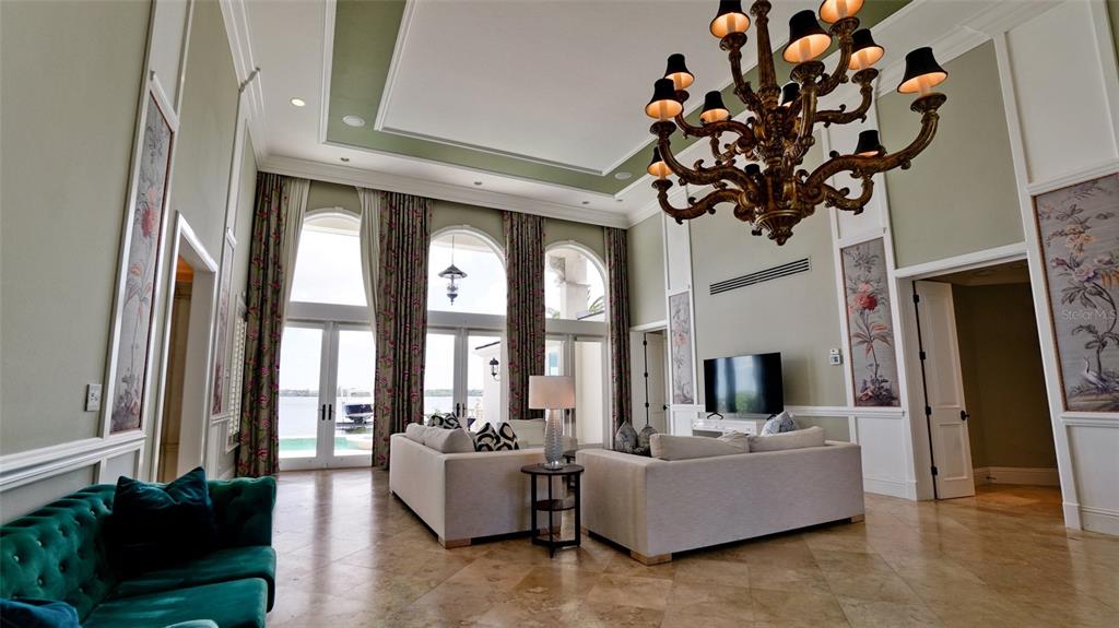 8213 Midnight Pass Road Sarasota, FL 34242 - Photo 9 of 52 a living room with fireplace furniture and a large window