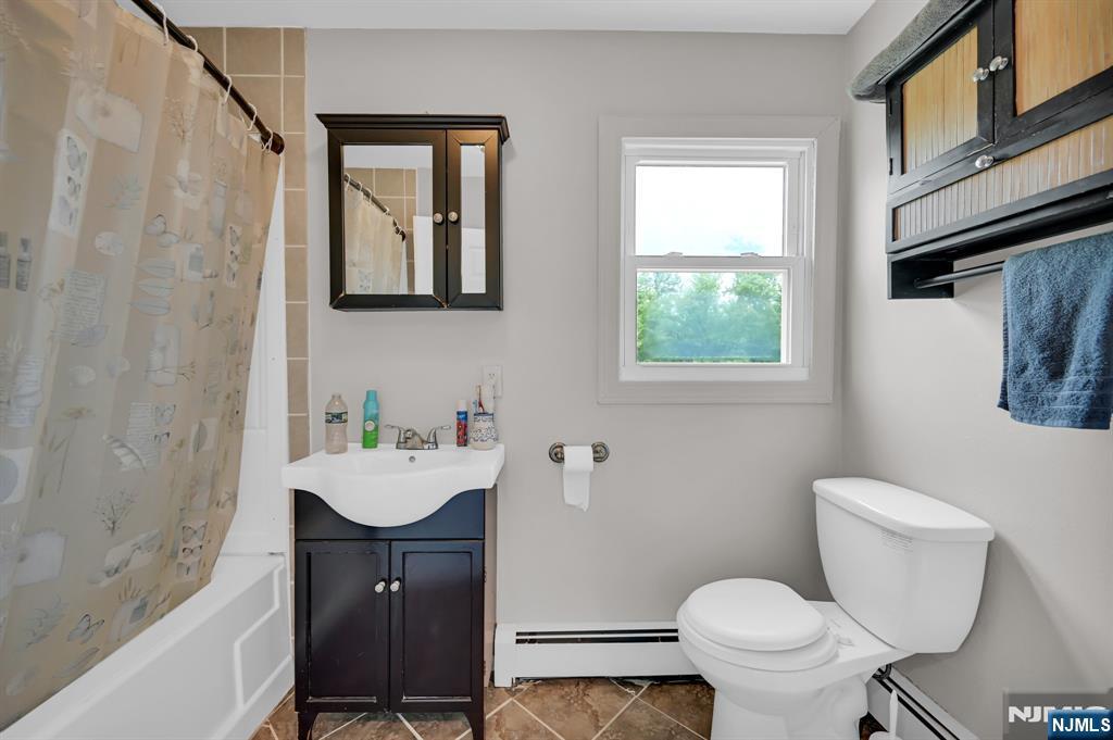 3 Riverside Road West Milford, NJ 07421 - Photo 19 of 29 a bathroom with a sink mirror and toilet