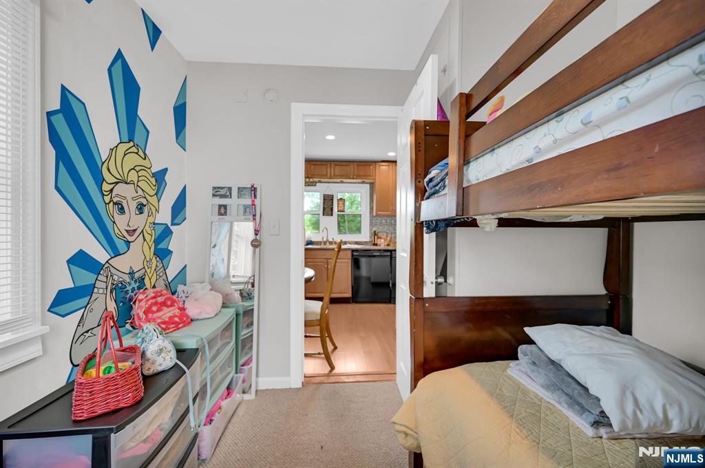 3 Riverside Road West Milford, NJ 07421 - Photo 21 of 29 a bedroom with a bed and a painting on the wall