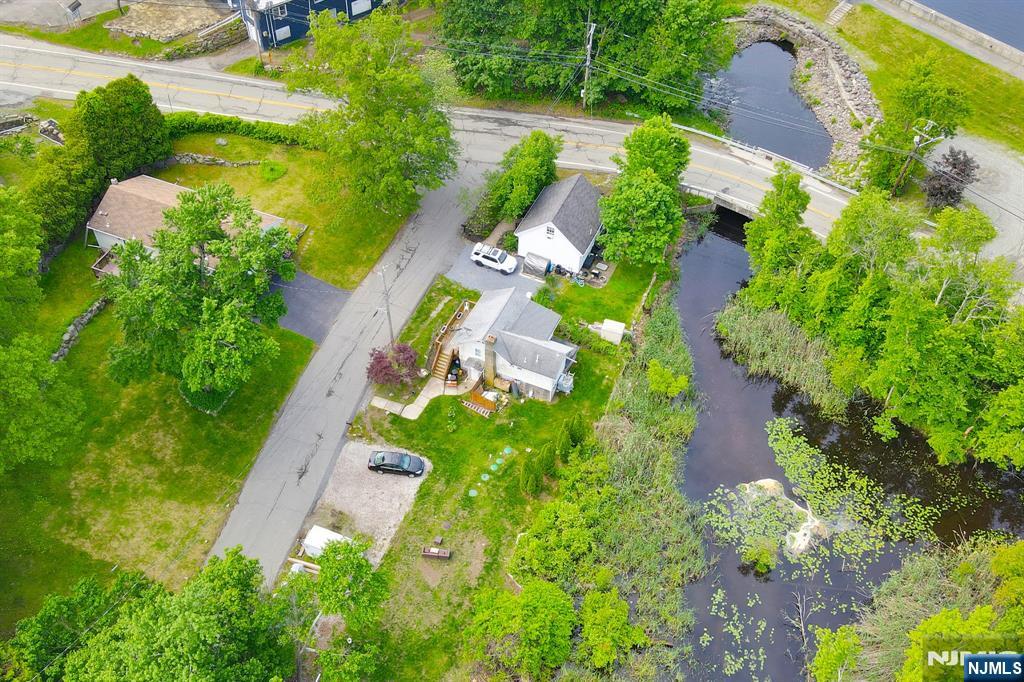 3 Riverside Road West Milford, NJ 07421 - Photo 25 of 29 an aerial view of residential house with outdoor space and trees all around