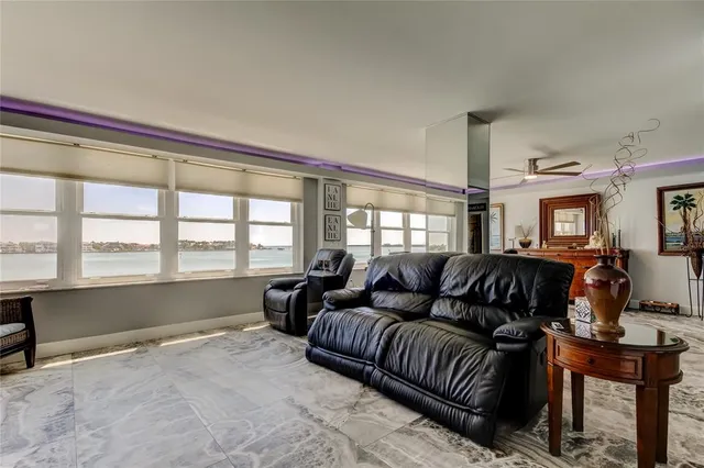 a bedroom with a large bed and a tv