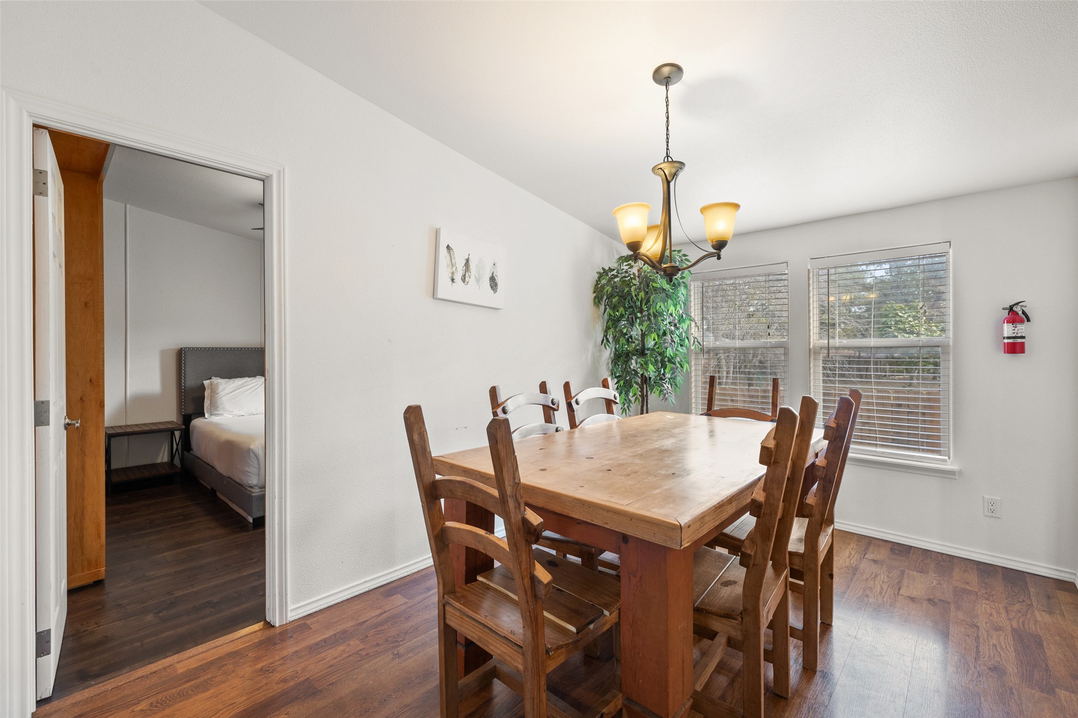 5519 Hiline Road Austin, TX 78734 - Photo 10 of 40 a view of a dining room with furniture and wooden floor