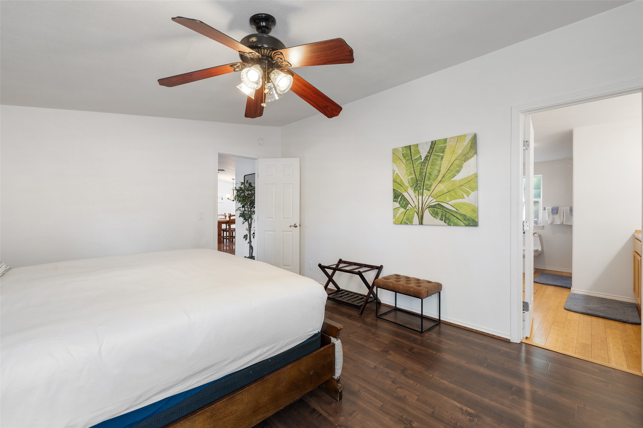 5519 Hiline Road Austin, TX 78734 - Photo 18 of 40 a bedroom with a bed and a chandelier