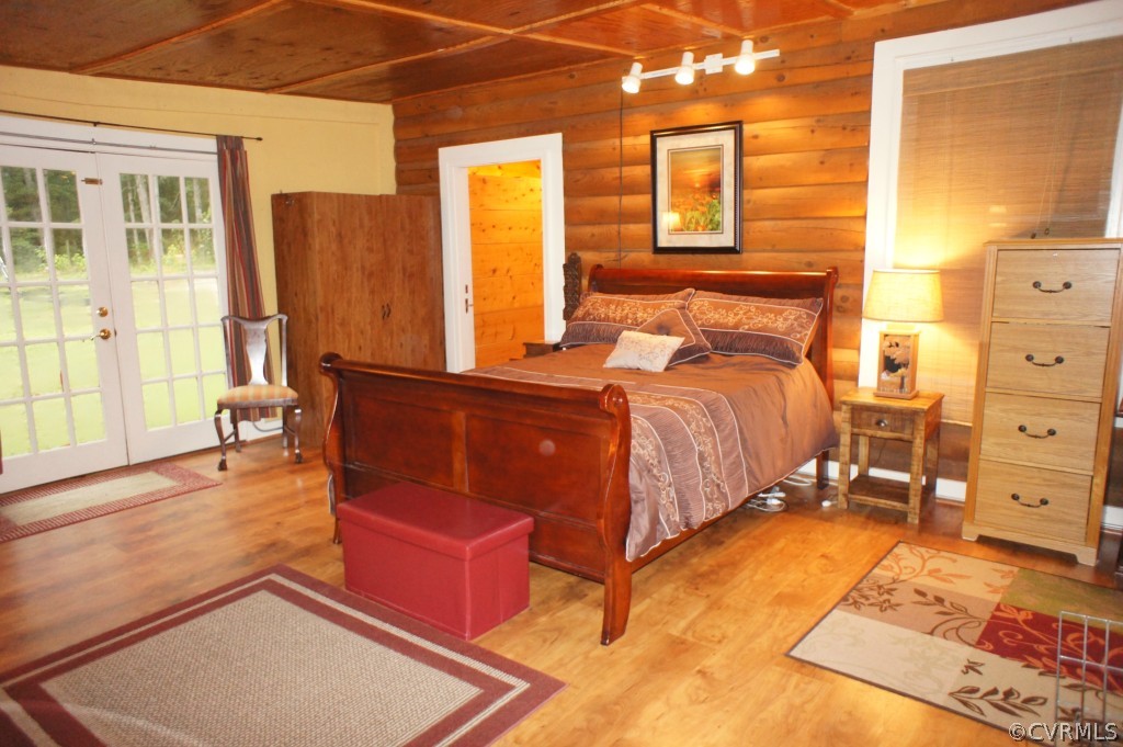 11250 Taylor Road Chesterfield, VA 23838 - Photo 13 of 24 a bedroom with a bed and wooden floor