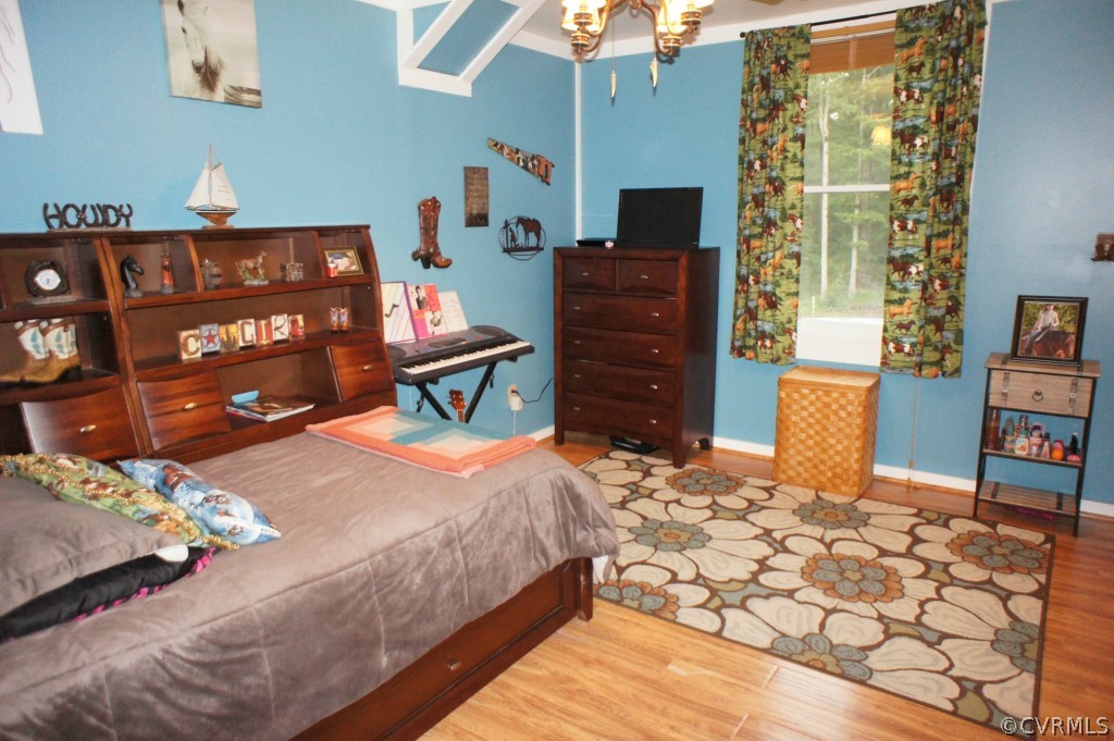 11250 Taylor Road Chesterfield, VA 23838 - Photo 15 of 24 a bedroom with a bed and dresser with mirror