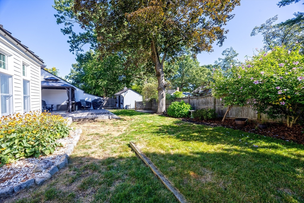 63 Bridle Path Road Springfield, MA 01118 - Photo 42 of 42 a backyard of a house with yard and outdoor seating