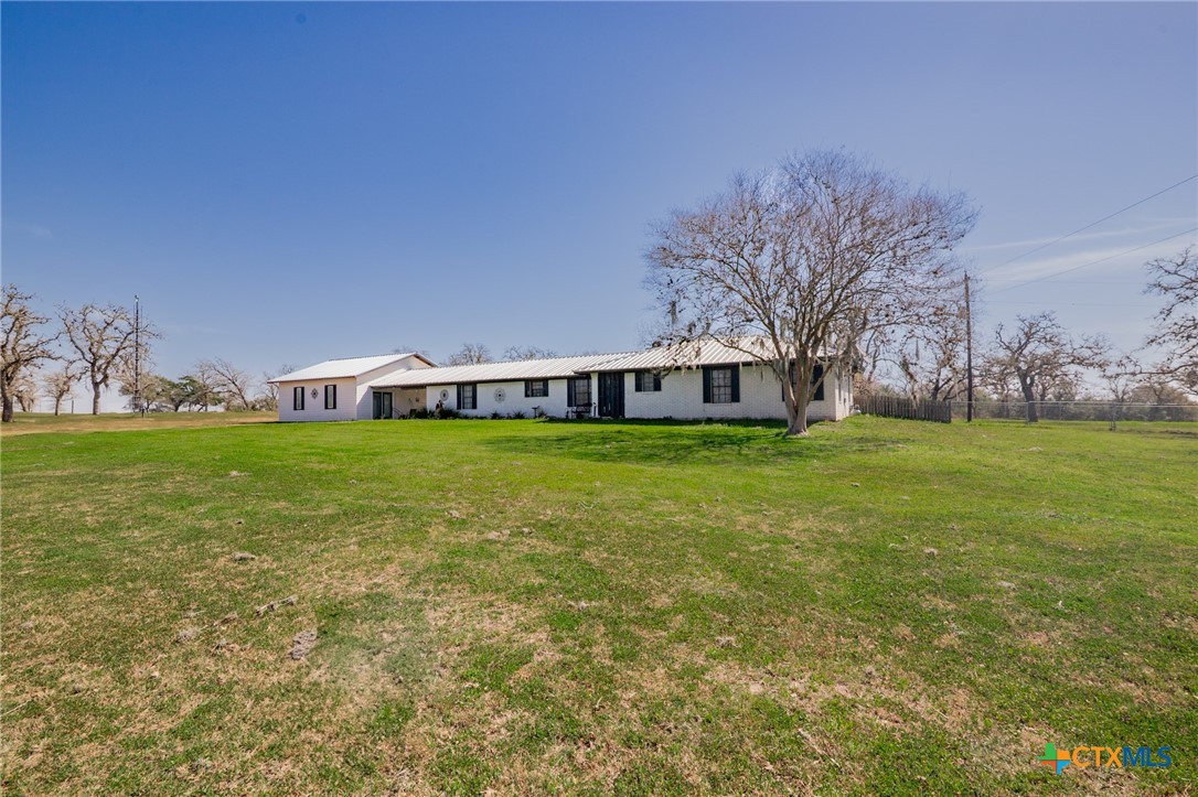 a view of a house with a big yard
