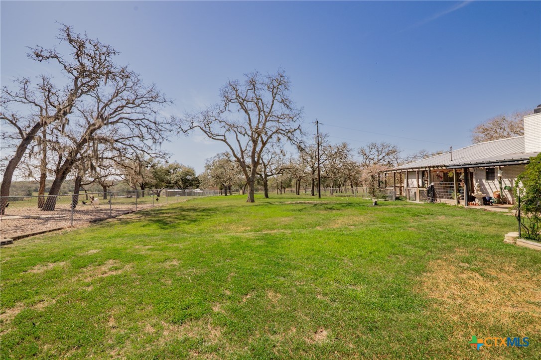 455 Suncrest Lane Victoria, TX 77905 - Photo 12 of 39 a view of yard with swimming pool and green space