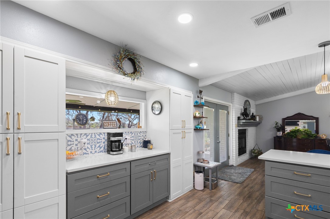 455 Suncrest Lane Victoria, TX 77905 - Photo 26 of 39 a kitchen with a refrigerator and cabinets