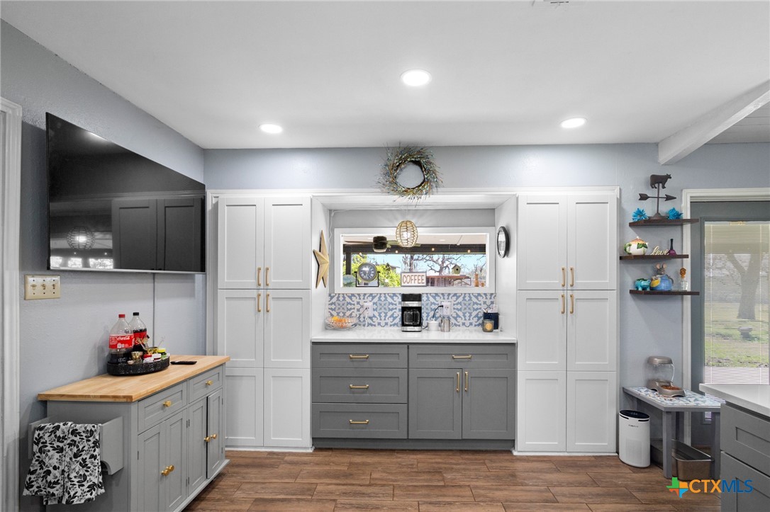 455 Suncrest Lane Victoria, TX 77905 - Photo 27 of 39 a kitchen with stainless steel appliances kitchen island granite countertop a sink and cabinets