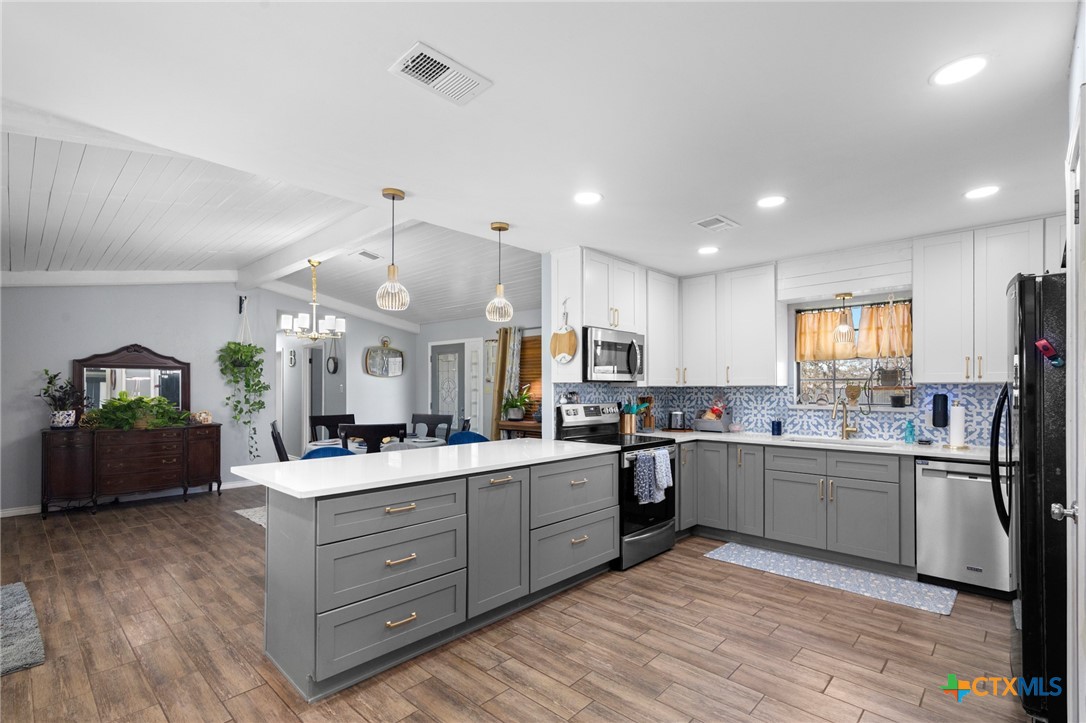 455 Suncrest Lane Victoria, TX 77905 - Photo 29 of 39 a kitchen with lots of counter top space and refrigerator