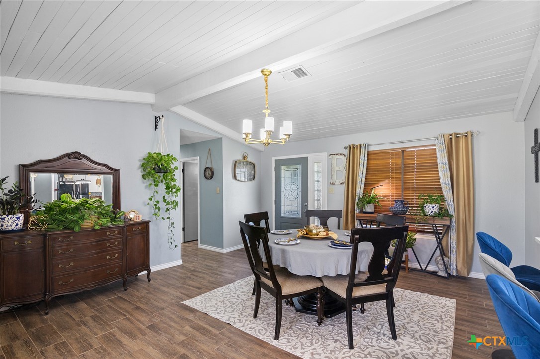 455 Suncrest Lane Victoria, TX 77905 - Photo 31 of 39 a view of a dining room with furniture and chandelier