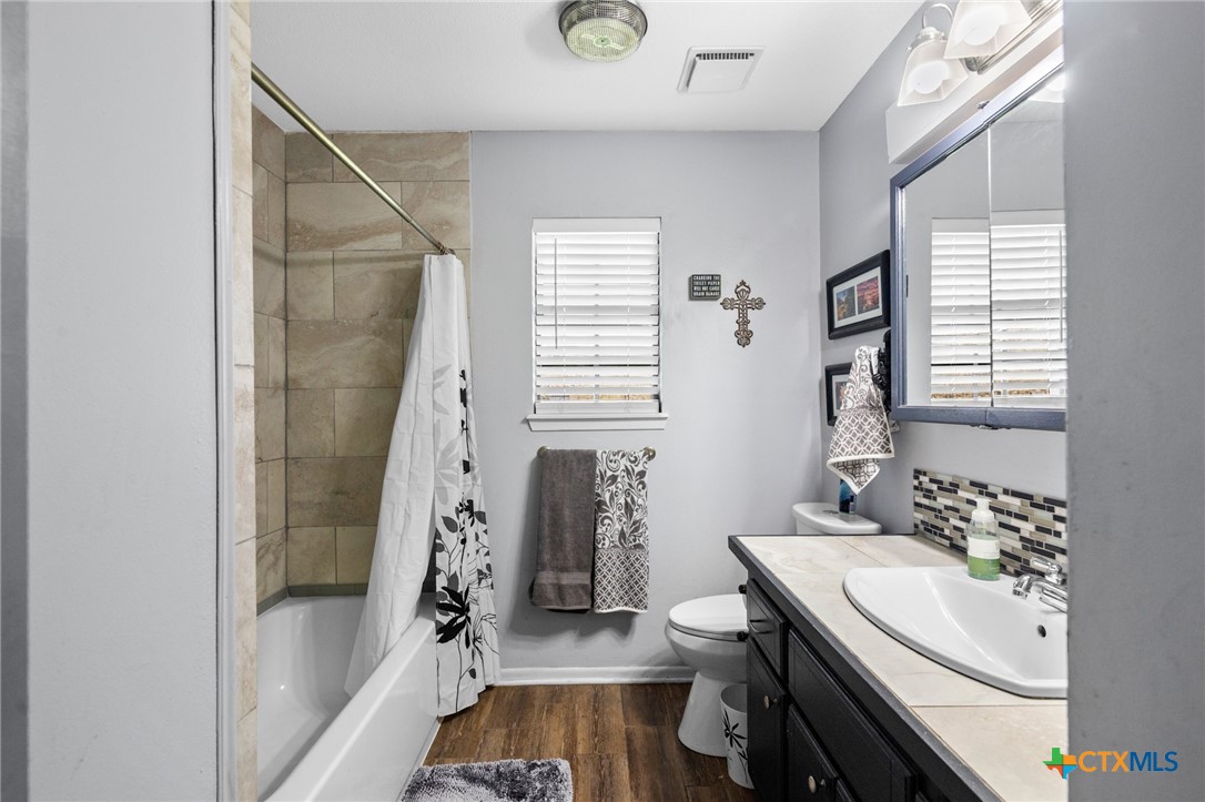 455 Suncrest Lane Victoria, TX 77905 - Photo 36 of 39 a bathroom with a sink a toilet and shower