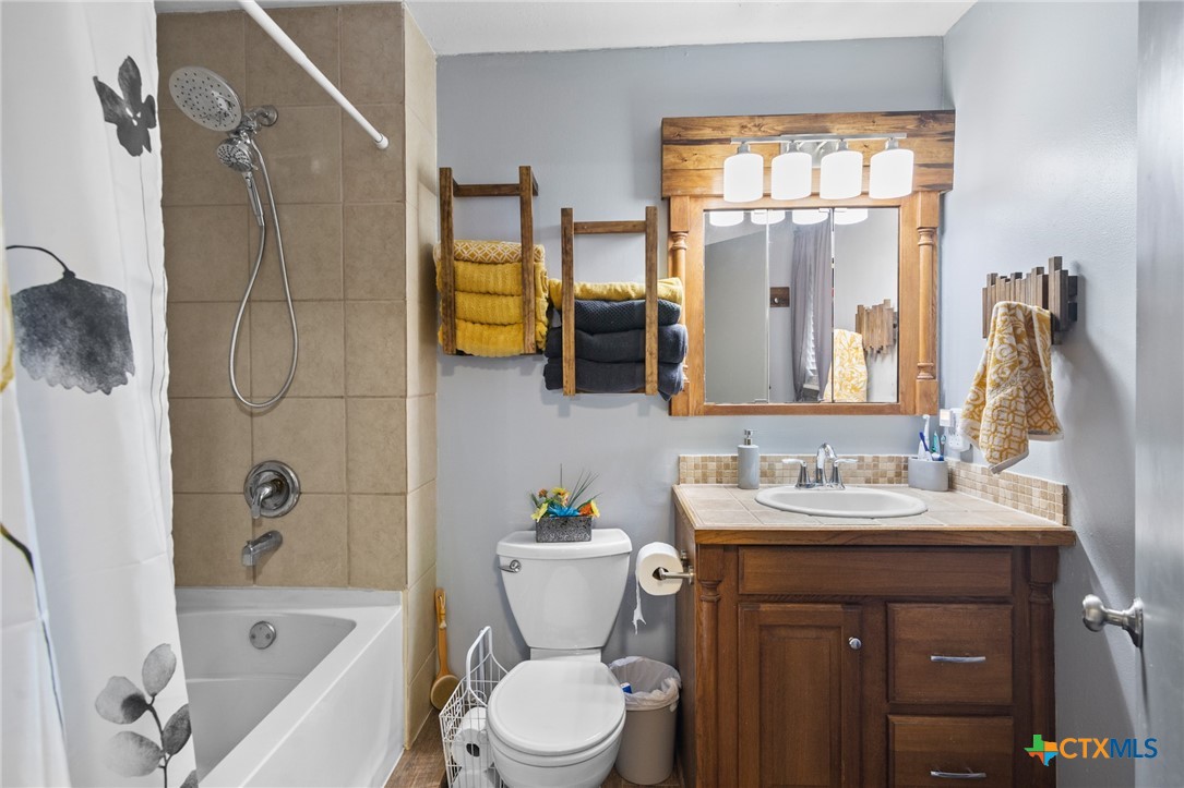 455 Suncrest Lane Victoria, TX 77905 - Photo 38 of 39 a bathroom with a sink a toilet and shower