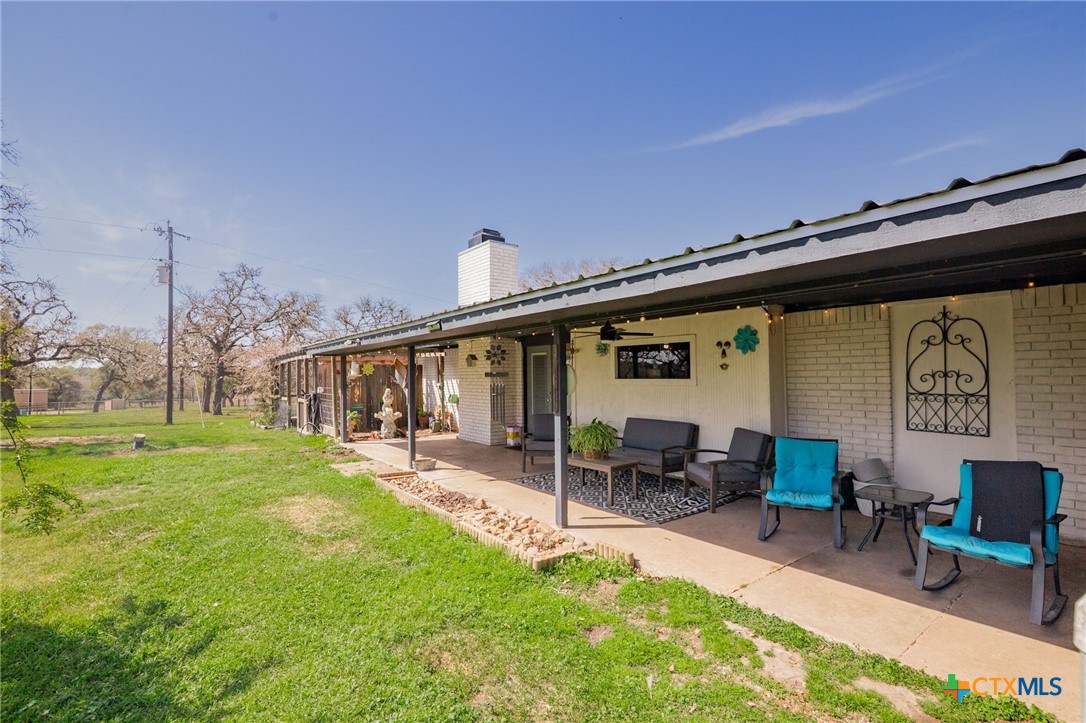 455 Suncrest Lane Victoria, TX 77905 - Photo 5 of 39 a backyard of a house with table and chairs