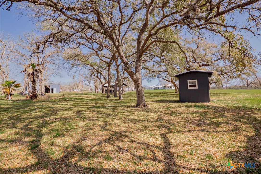 455 Suncrest Lane Victoria, TX 77905 - Photo 7 of 39 a house with trees in front of it