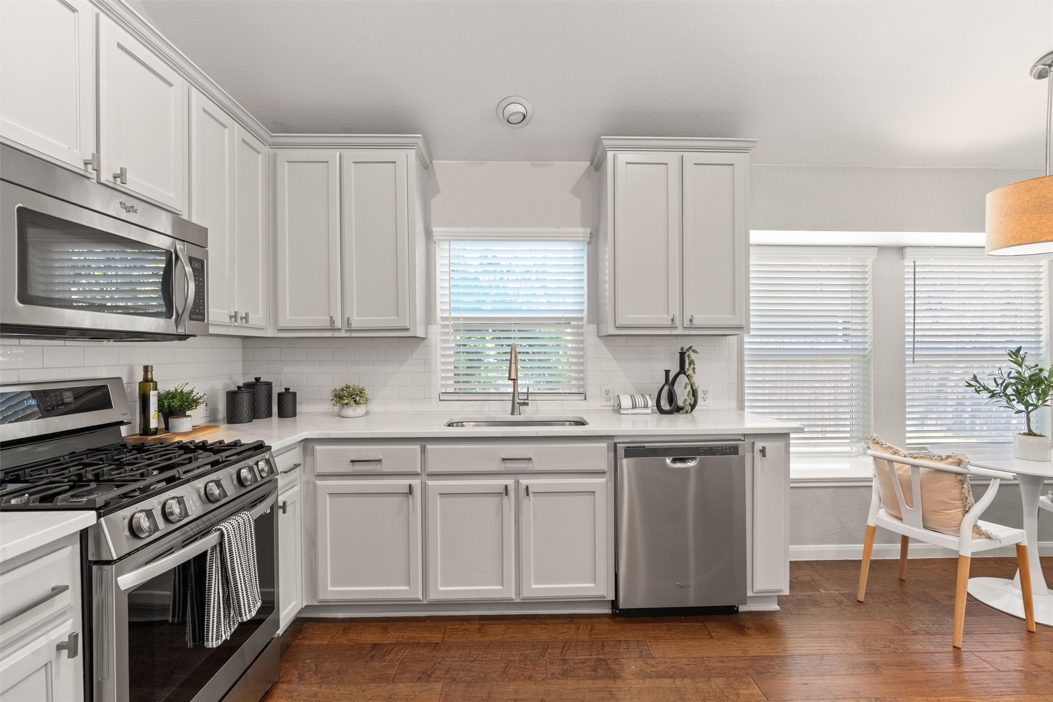 129 Summers Green Georgetown, TX 78633 - Photo 11 of 30 a kitchen with stainless steel appliances granite countertop a stove a sink and white cabinets