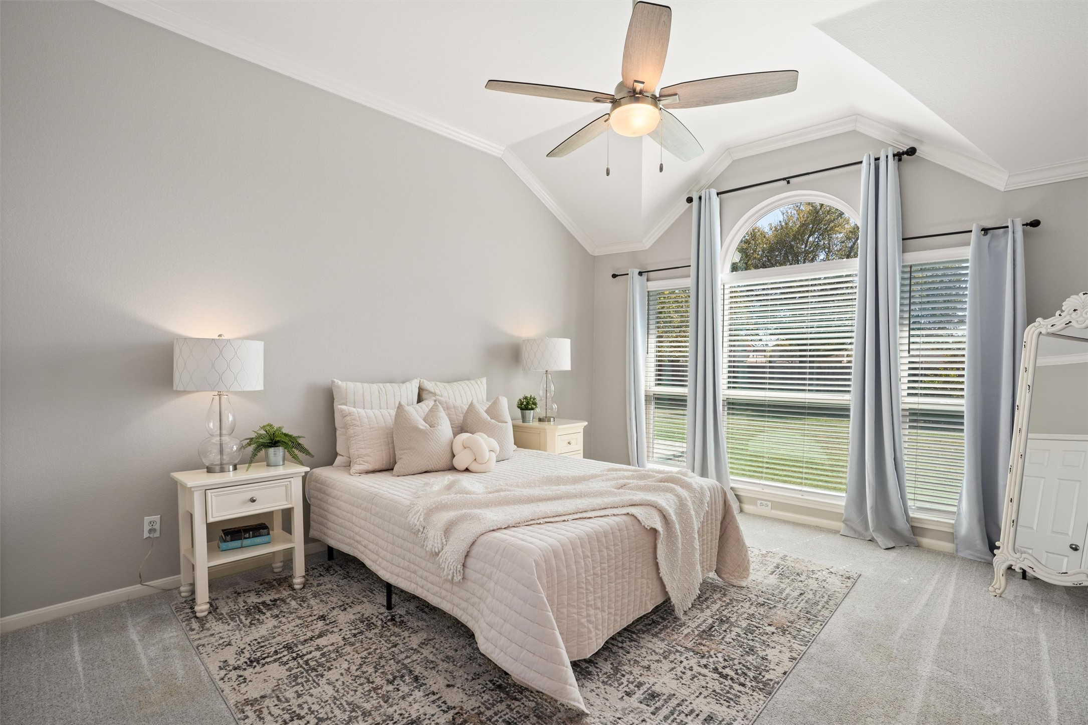 129 Summers Green Georgetown, TX 78633 - Photo 17 of 30 a bedroom with a large bed and a chandelier