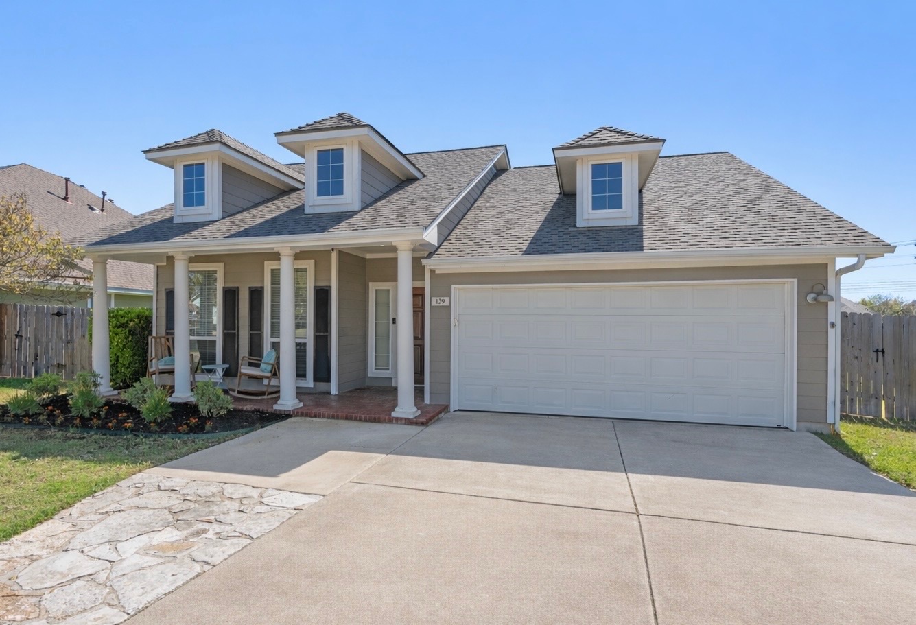 129 Summers Green Georgetown, TX 78633 - Photo 2 of 30 a front view of a house with garden