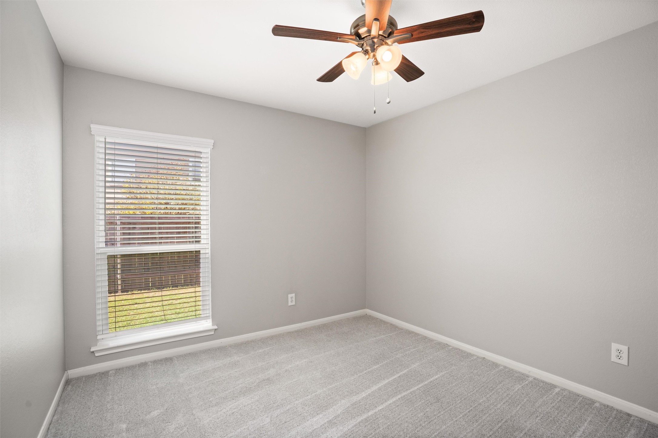129 Summers Green Georgetown, TX 78633 - Photo 23 of 30 an empty room with a window and a fan