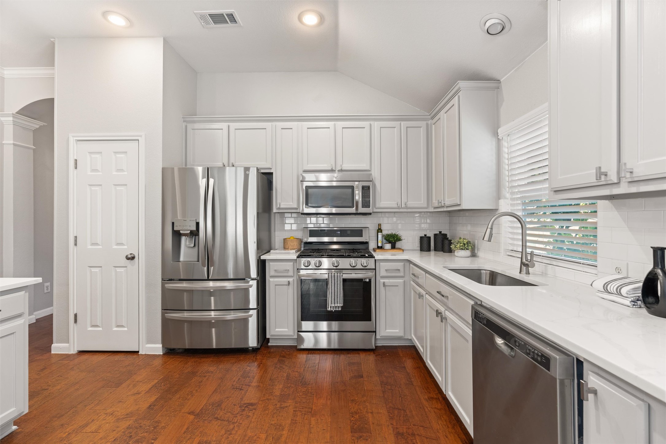 129 Summers Green Georgetown, TX 78633 - Photo 10 of 30 a kitchen with stainless steel appliances a refrigerator sink and microwave