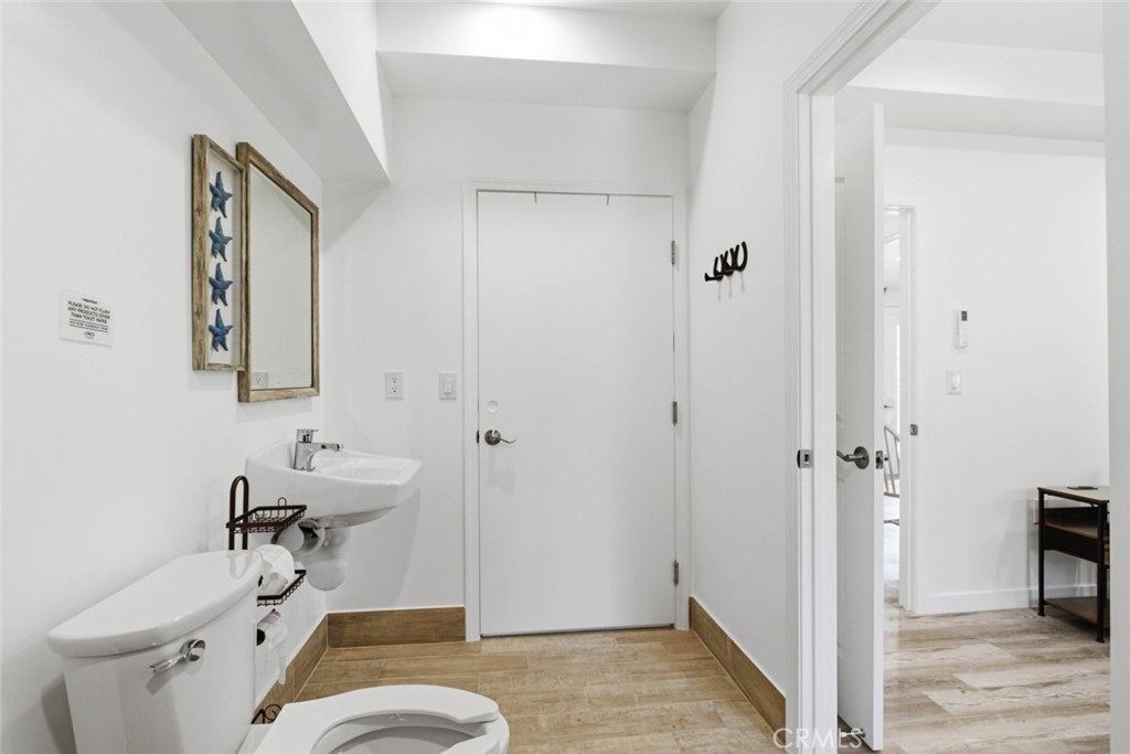 301 West Ashby Street Azusa, CA 91702 - Photo 70 of 75 a bathroom with a sink a toilet and shower