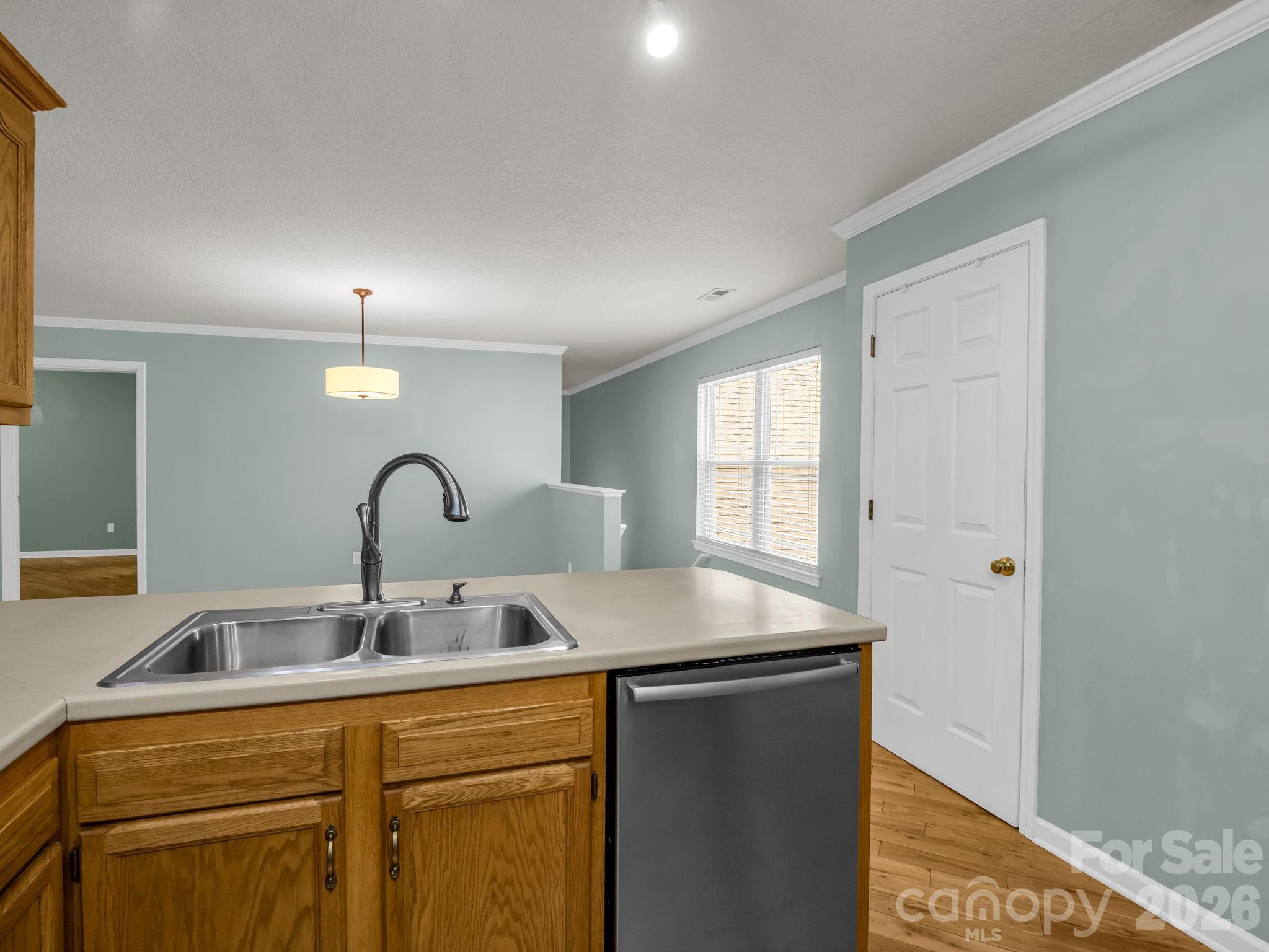 4 Rathfarnham Road, Unit 4F Asheville, NC 28803 - Photo 16 of 33 a kitchen with a sink and cabinets