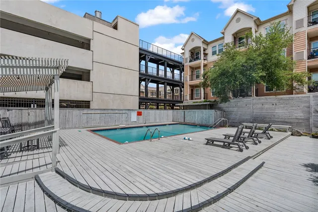 a view of a balcony with two chairs