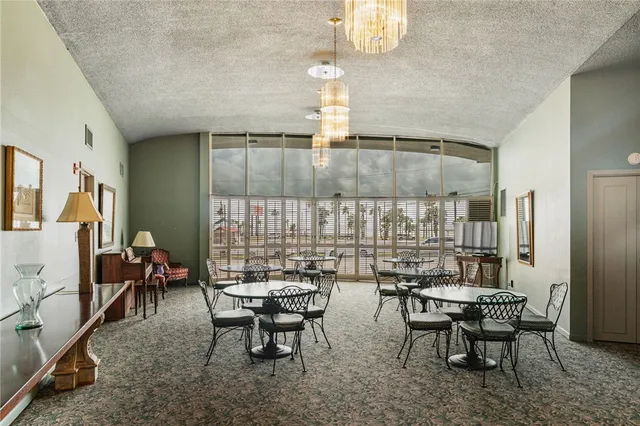 a dinning table and chairs in a room