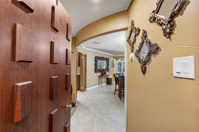 a view of a hallway with paintings on the wall