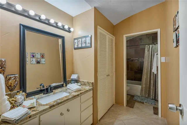 a bathroom with a double vanity sink and a mirror