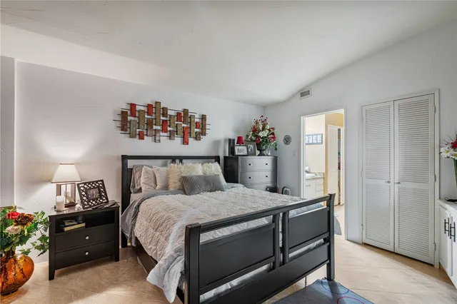 a bedroom with a bed and a table