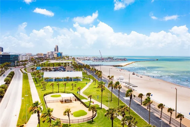 a view of a swimming pool with a table and chairs