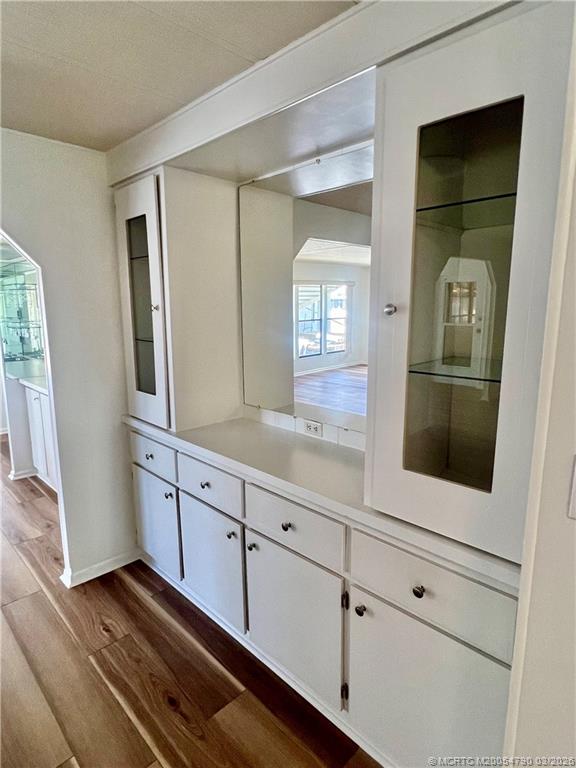 2692 Southwest Pontiac Place Stuart, FL 34997 - Photo 11 of 20 a bathroom with a sink a mirror and a bathtub