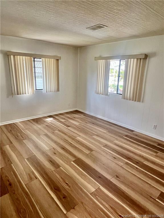 2692 Southwest Pontiac Place Stuart, FL 34997 - Photo 14 of 20 a view of an empty room with windows