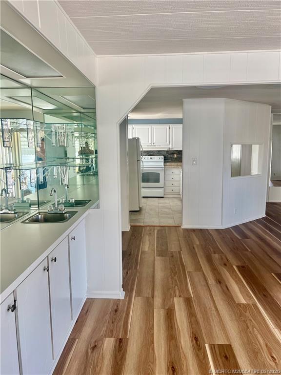 2692 Southwest Pontiac Place Stuart, FL 34997 - Photo 4 of 20 a view of a kitchen from the hallway