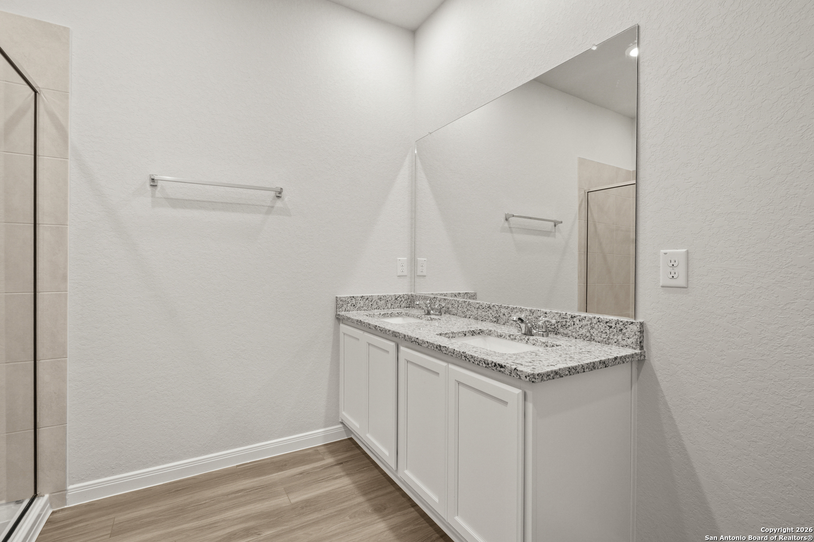 3215 Katzer Lane Converse, TX 78109 - Photo 19 of 23 a bathroom with a granite countertop sink and a mirror
