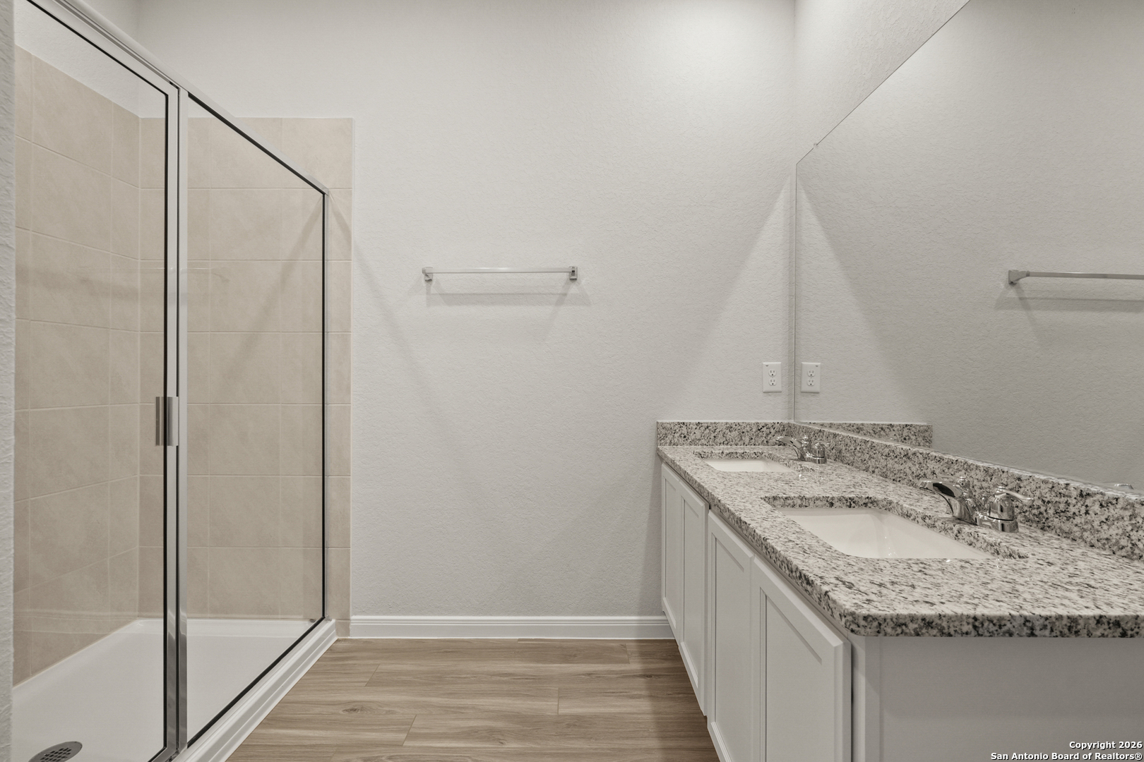 3215 Katzer Lane Converse, TX 78109 - Photo 20 of 23 a bathroom with a granite countertop sink and a mirror