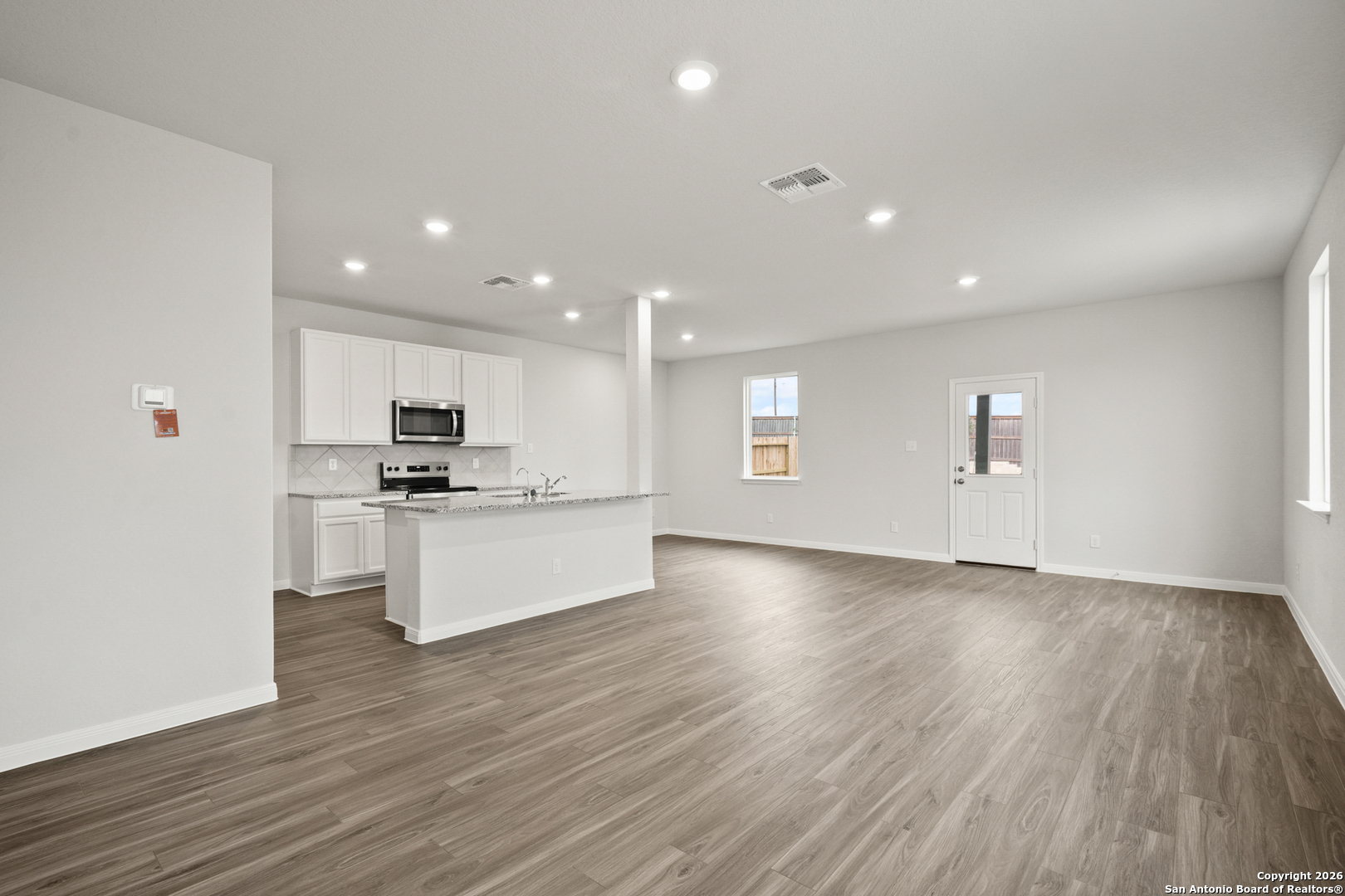 3215 Katzer Lane Converse, TX 78109 - Photo 4 of 23 a view of kitchen with sink and wooden floor