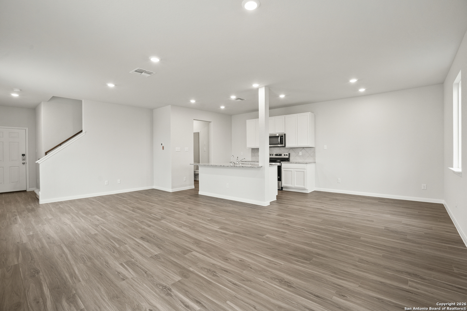 3215 Katzer Lane Converse, TX 78109 - Photo 5 of 23 a view of kitchen with a sink wooden floor and a kitchen
