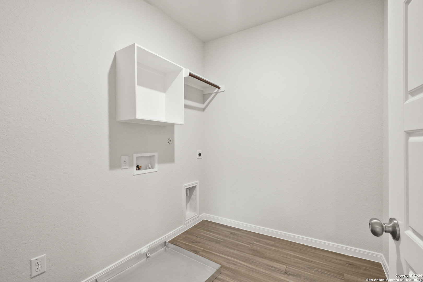 3215 Katzer Lane Converse, TX 78109 - Photo 10 of 23 a view of small space with wooden floor and white walls