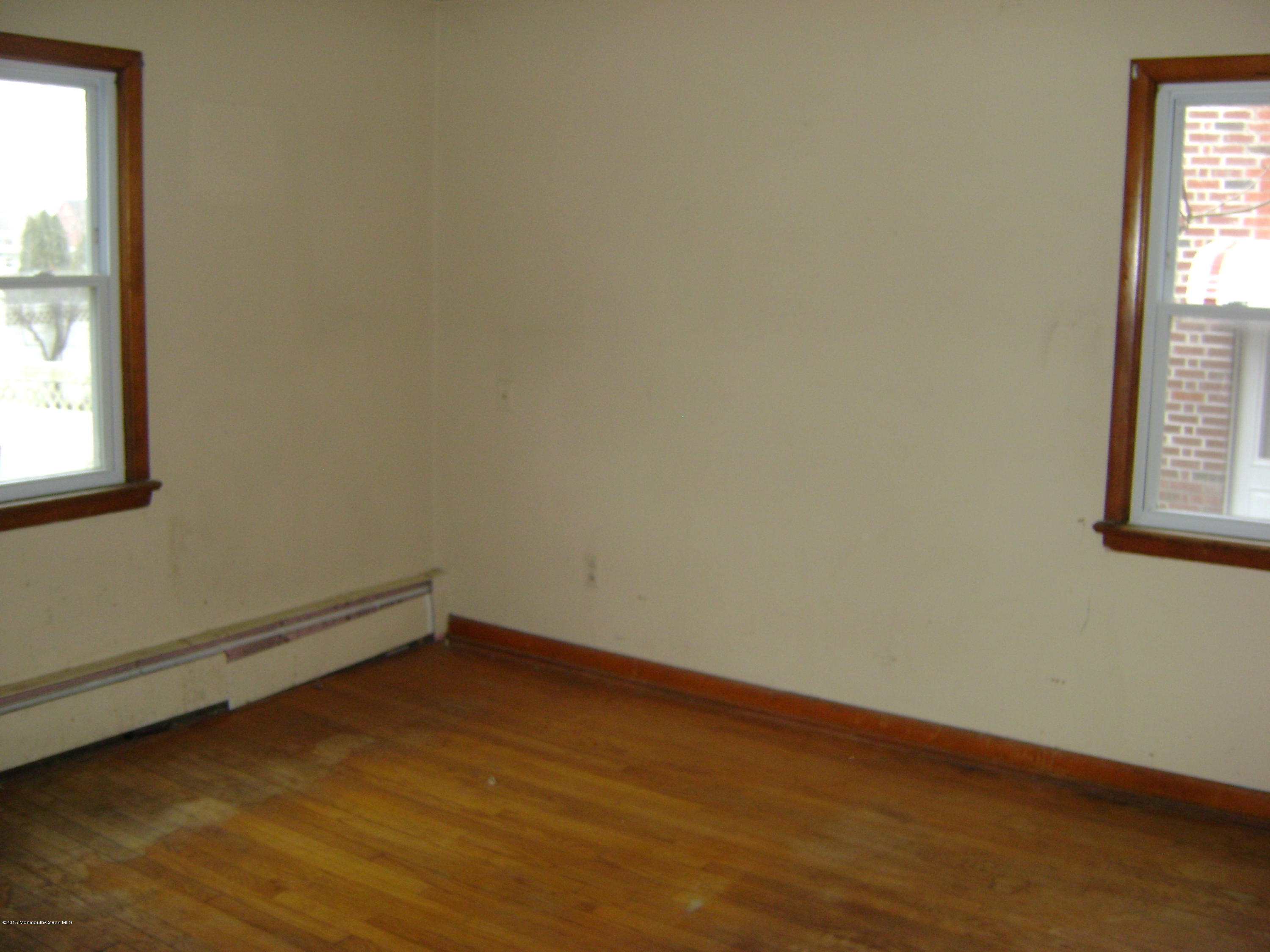 9 Howland Avenue Long Branch, NJ 07740 - Photo 4 of 11 an empty room with a window