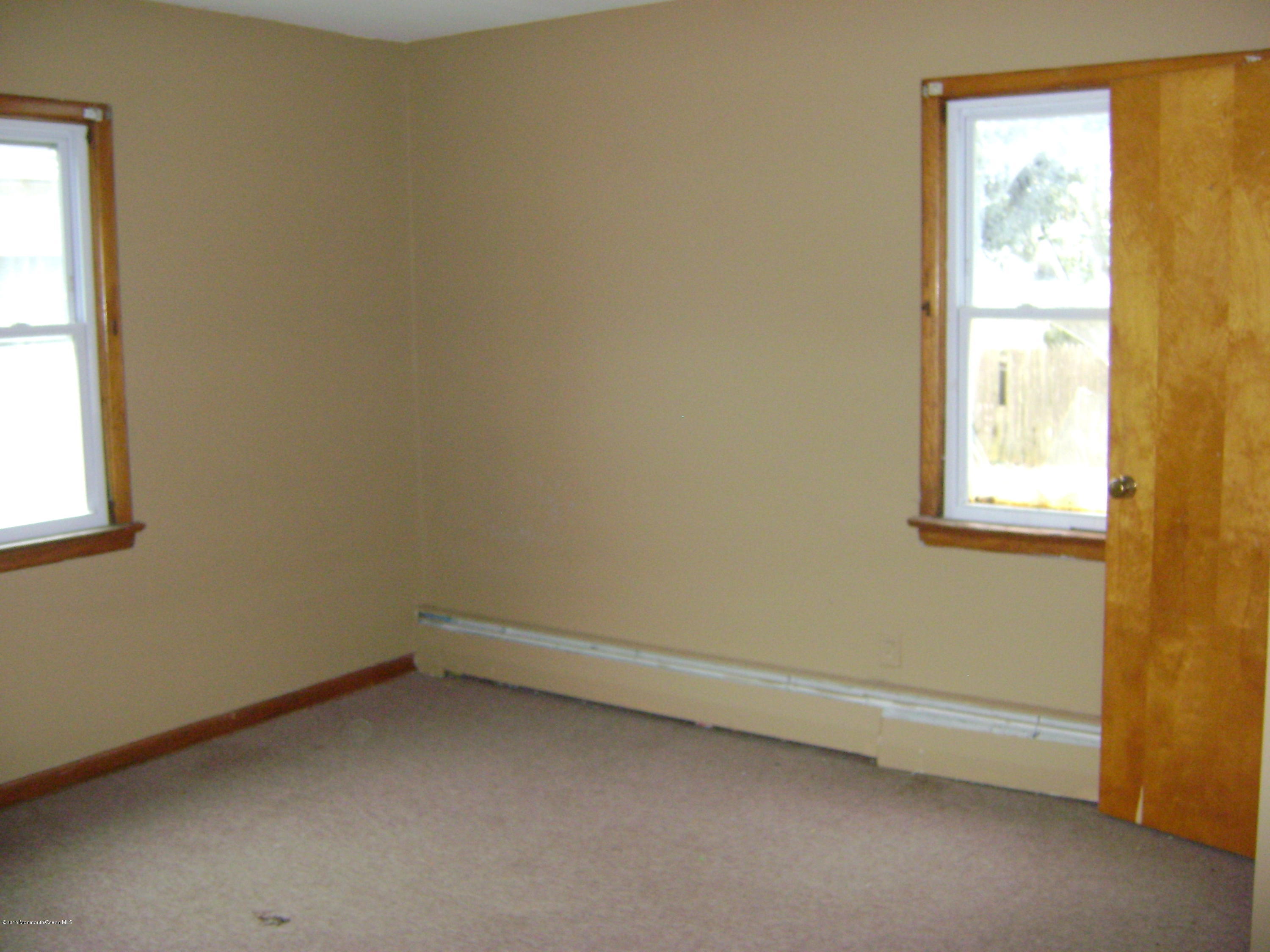 9 Howland Avenue Long Branch, NJ 07740 - Photo 5 of 11 an empty room with a window