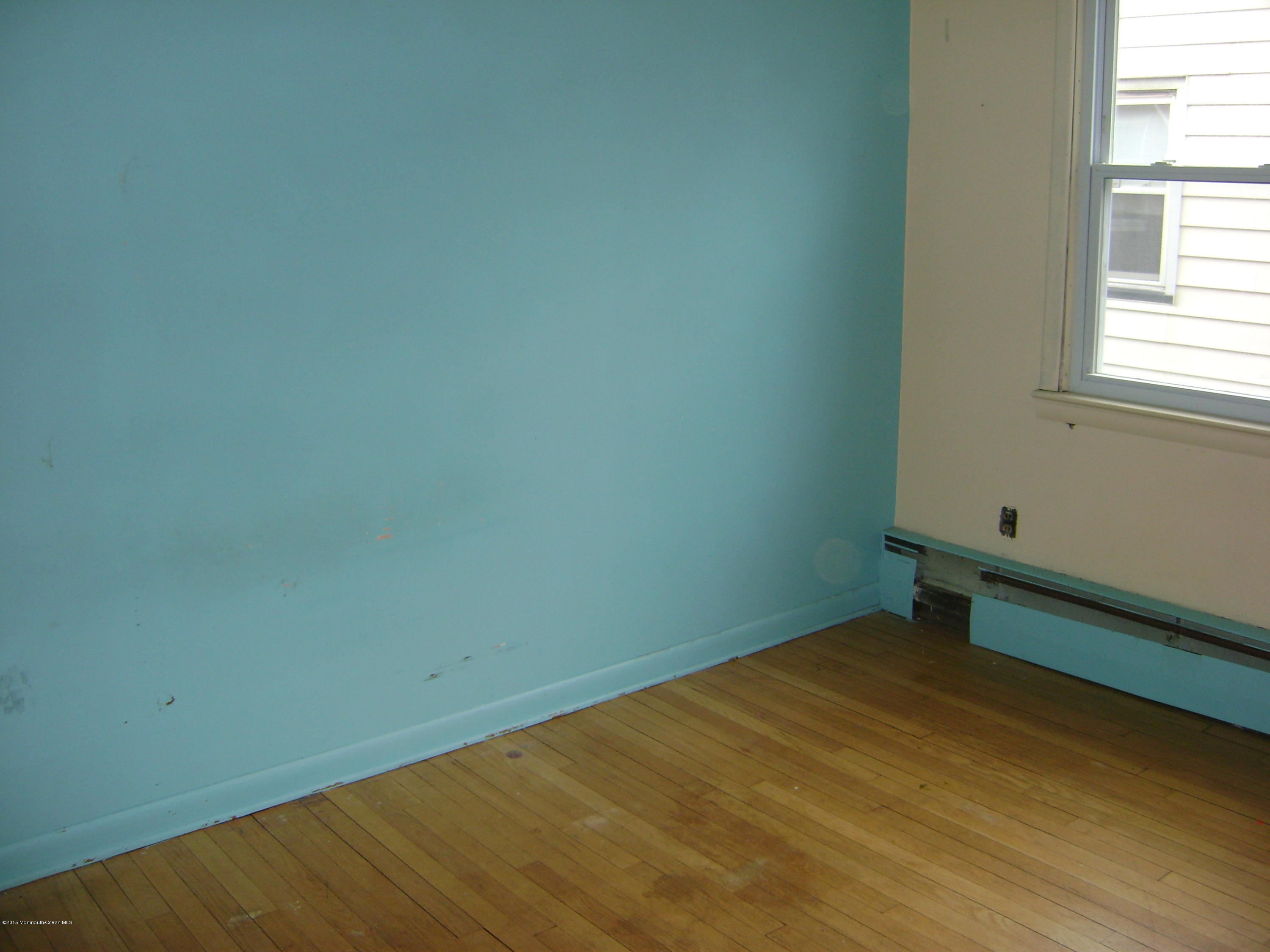 9 Howland Avenue Long Branch, NJ 07740 - Photo 6 of 11 an empty room with a window