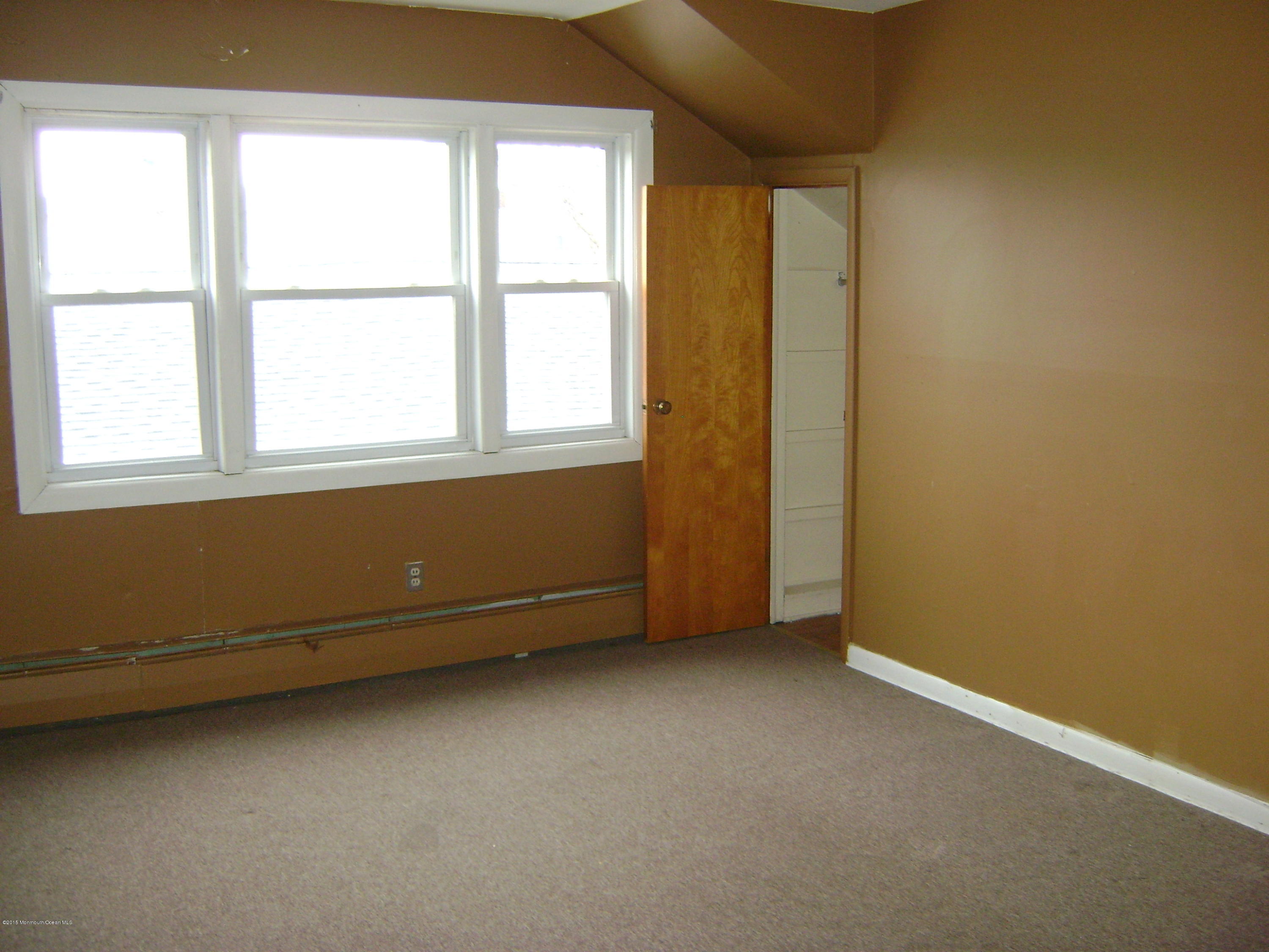 9 Howland Avenue Long Branch, NJ 07740 - Photo 8 of 11 an empty room with a window