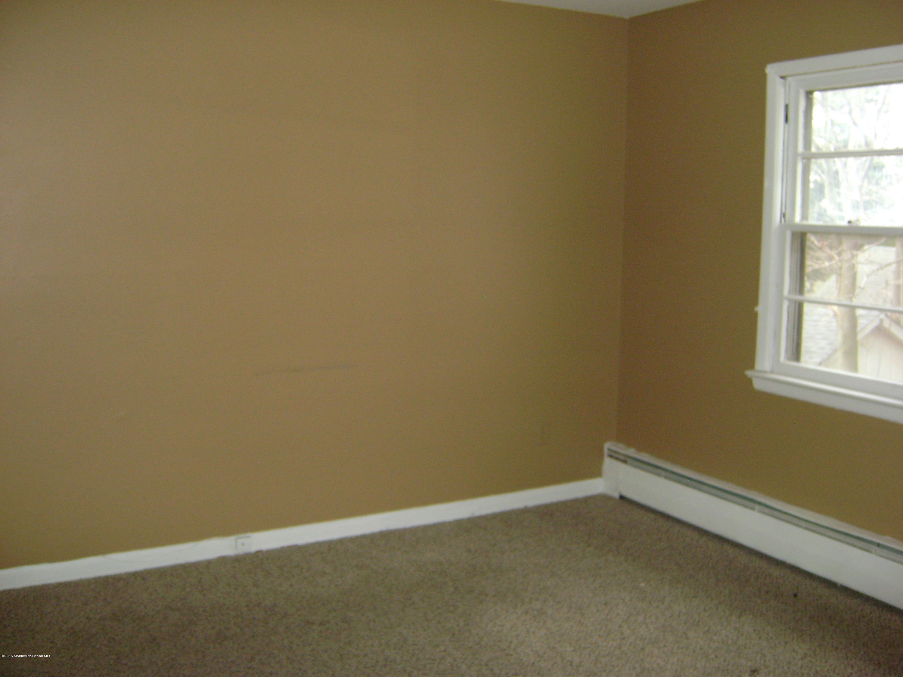 9 Howland Avenue Long Branch, NJ 07740 - Photo 10 of 11 an empty room with a window