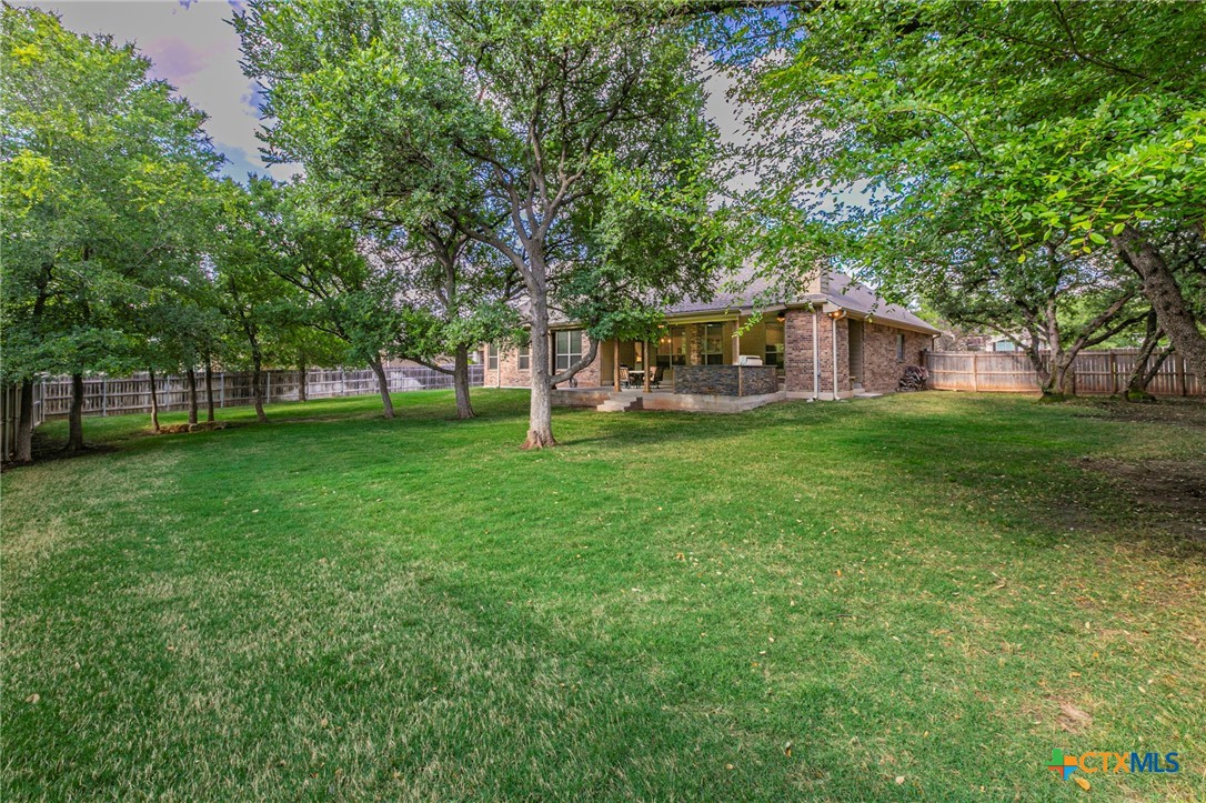 8 Daingerfield Cove Morgan's Point Resort, TX 76513 - Photo 25 of 28 a view of a house with a yard