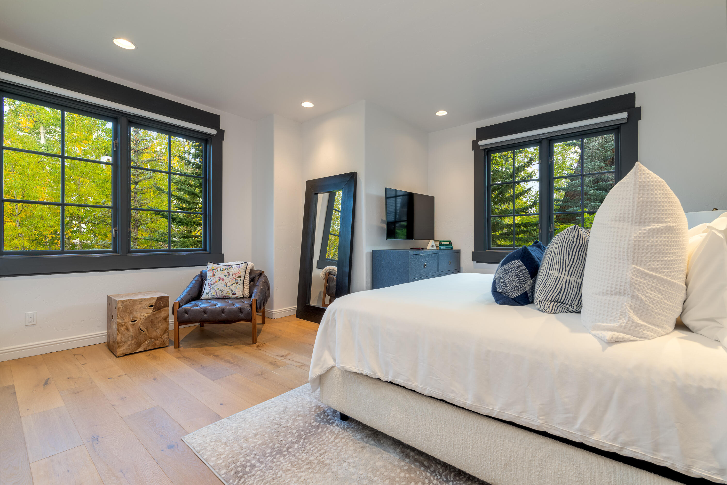 101 Sunny Ridge Place, Unit 101 Mountain Village, CO 81435 - Photo 17 of 30 a bedroom with a large bed and a large window